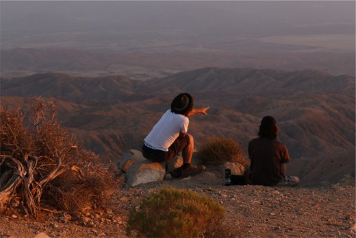 2 youth looking out into rural landscape