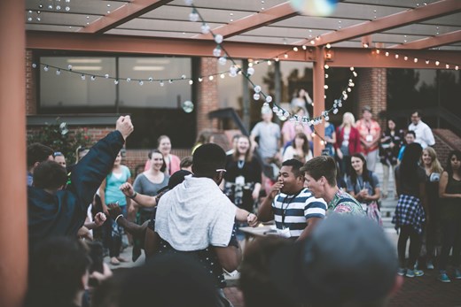 Group of teenagers at a party smiling